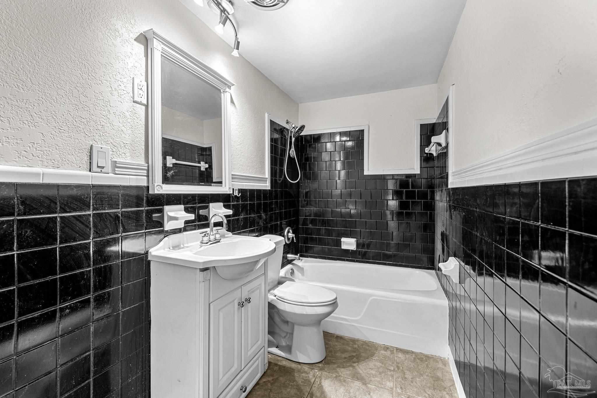 162 West Burgess Road Pensacola, FL 32503 - Photo 20 of 30 a bathroom with a sink a toilet and shower