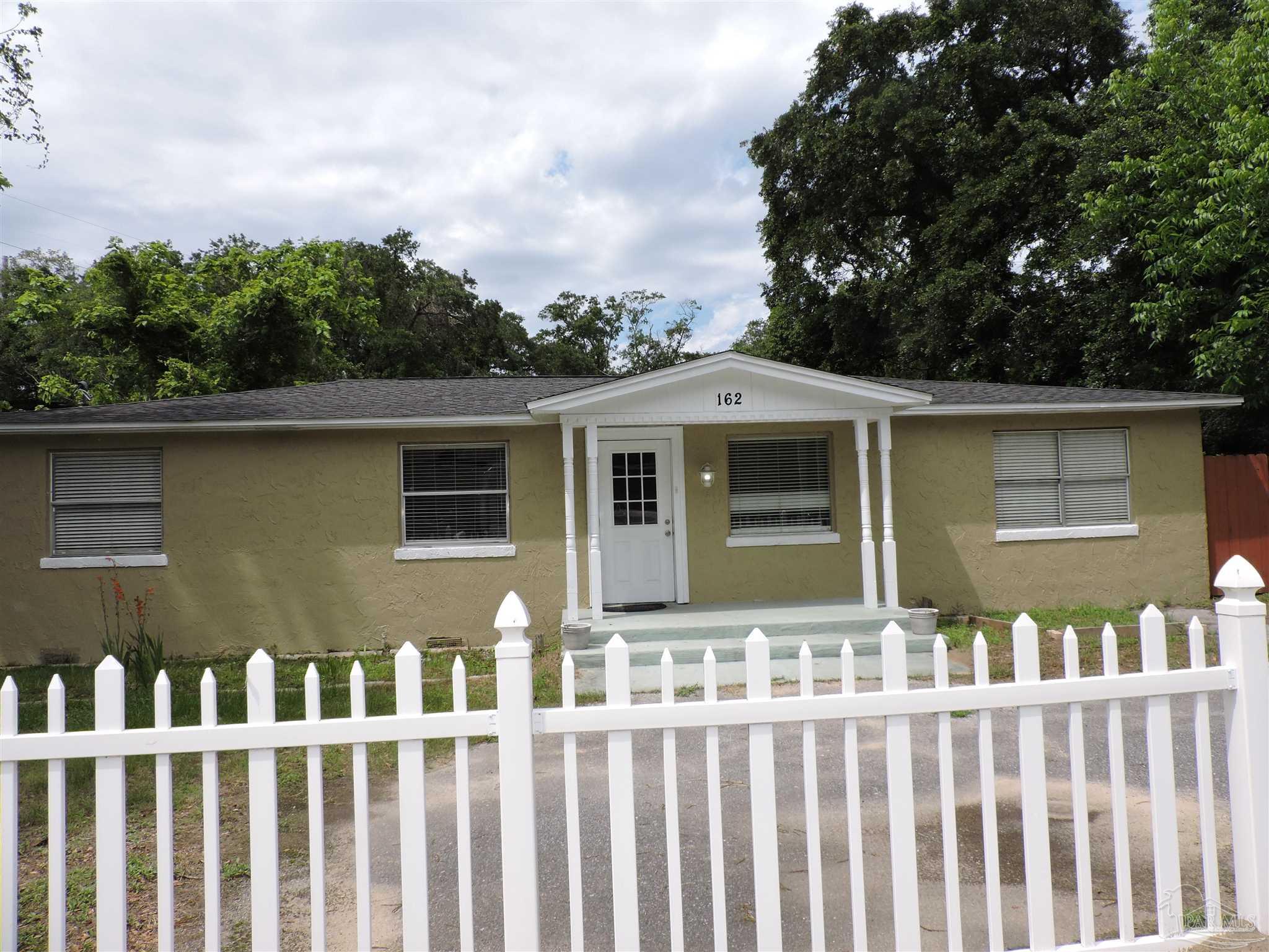 162 West Burgess Road Pensacola, FL 32503 - Photo 2 of 30 a front view of a house with a garden