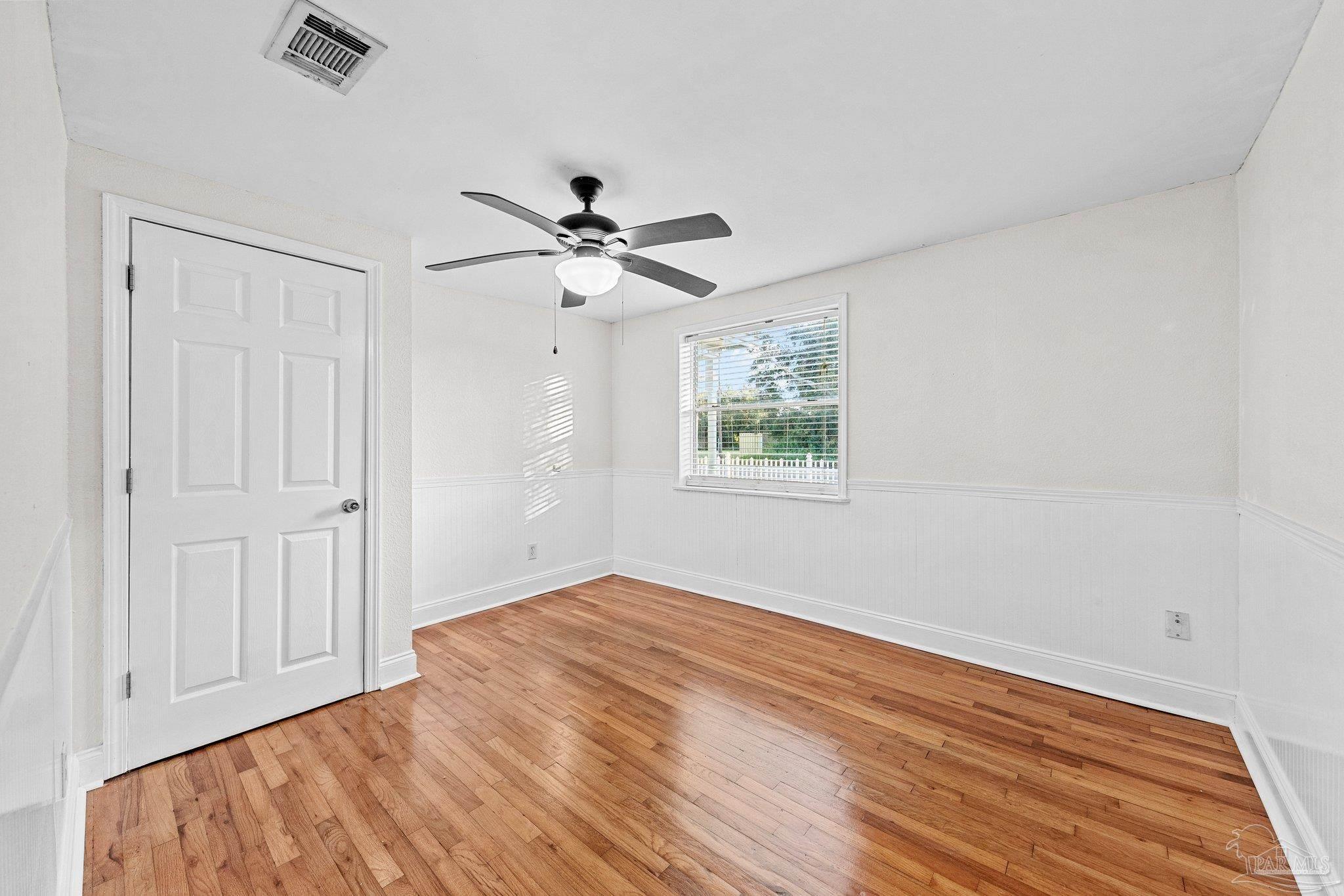 162 West Burgess Road Pensacola, FL 32503 - Photo 22 of 30 wooden floor in an empty room