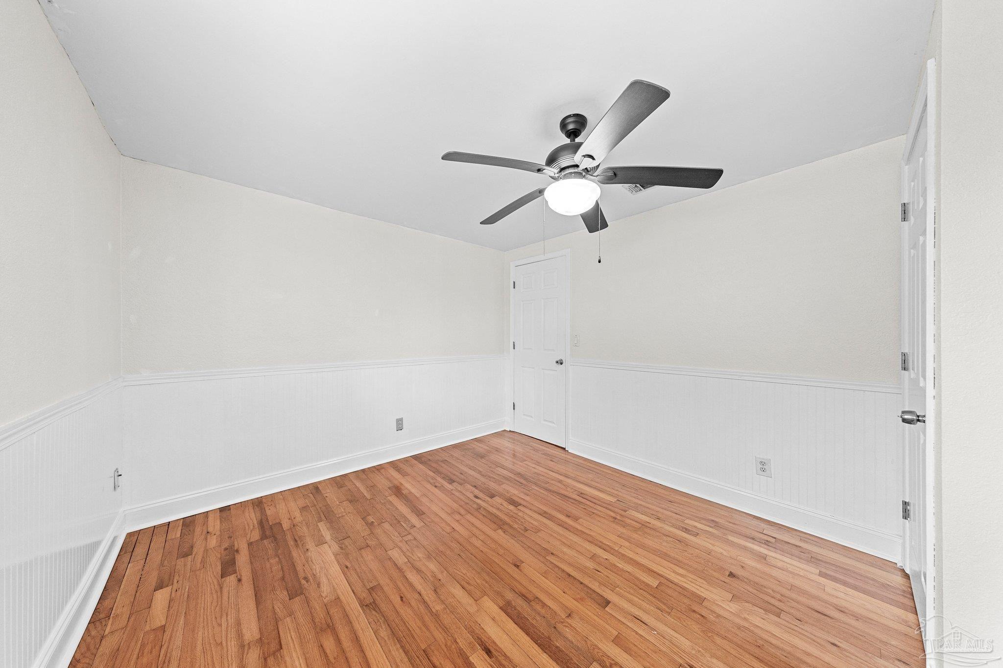162 West Burgess Road Pensacola, FL 32503 - Photo 23 of 30 wooden floor in an empty room