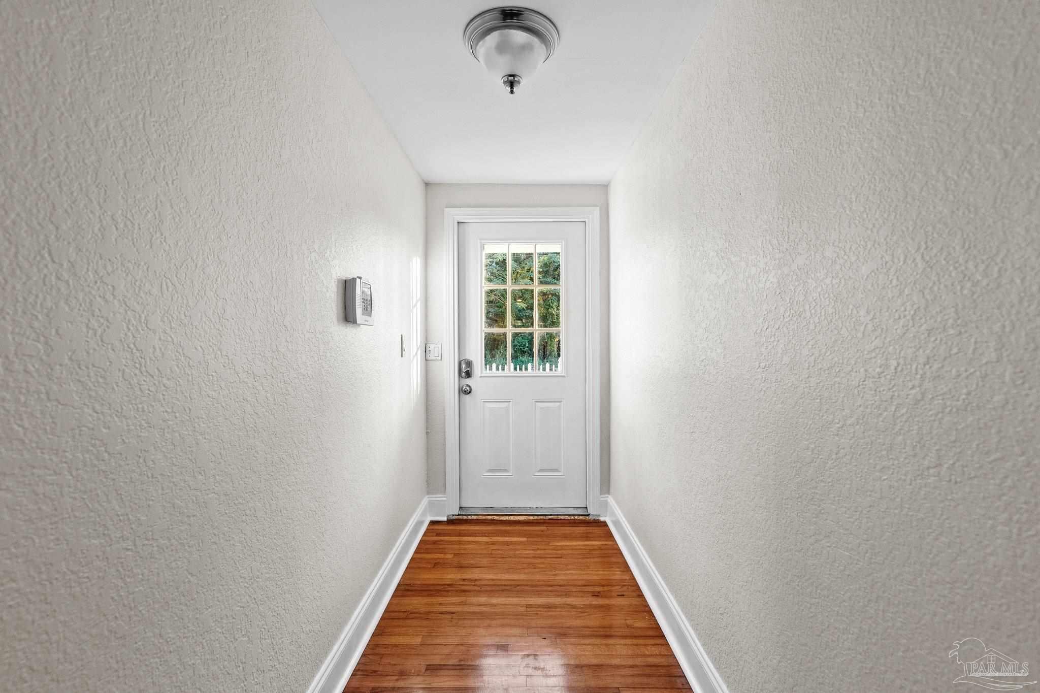 162 West Burgess Road Pensacola, FL 32503 - Photo 3 of 30 a view of a hallway with a window