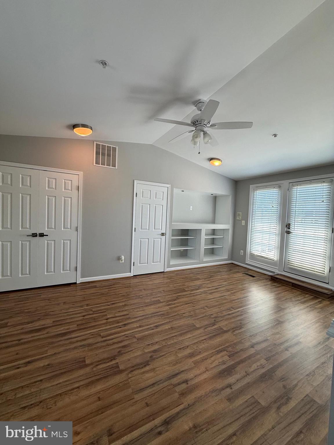 12108 Kinsley Place Reston, VA 20190 - Photo 16 of 17 wooden floor in an empty room with a window