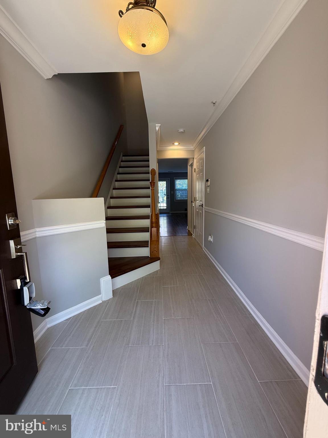 12108 Kinsley Place Reston, VA 20190 - Photo 2 of 17 a view of an empty room with wooden floor