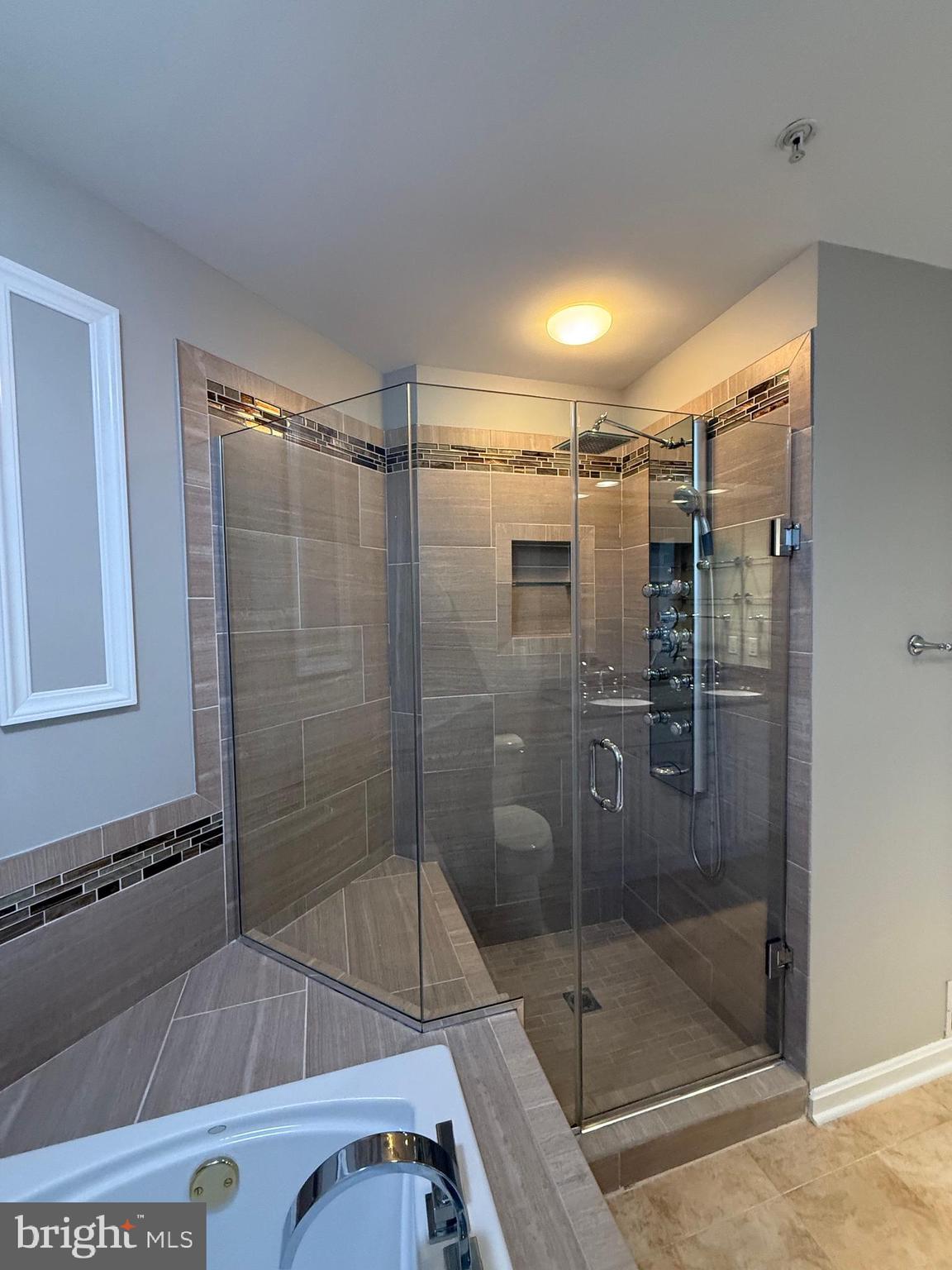 12108 Kinsley Place Reston, VA 20190 - Photo 10 of 17 a bathroom with a shower