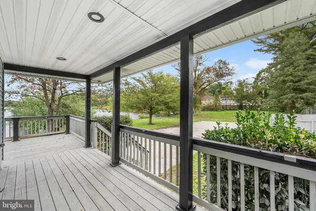 a view of a balcony with wooden floor