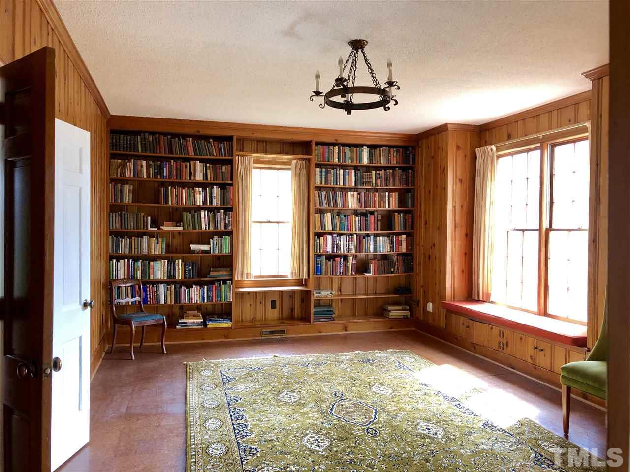 Wonderful bookcases, French doors to the screen porch, French doors to the living room, window seat