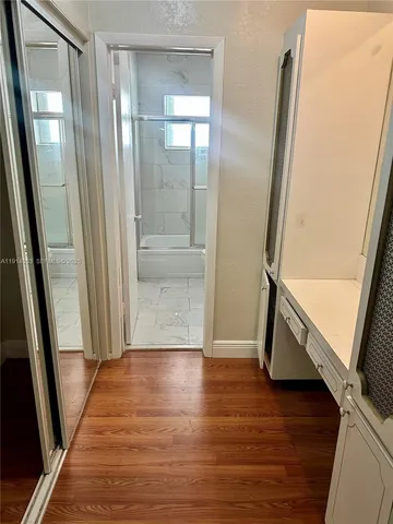 a view of front door with wooden floor