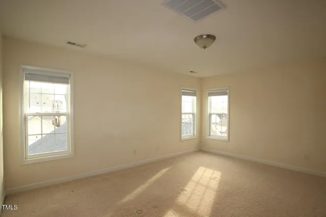 a bathroom with a double vanity sink and mirror with bathtub