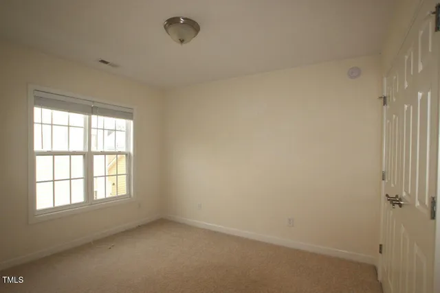 a bathroom with a sink vanity mirror and toilet