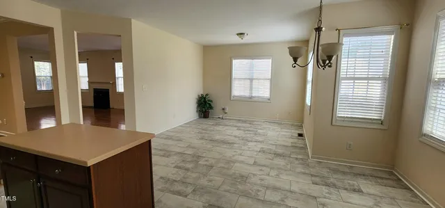 a kitchen with stainless steel appliances granite countertop a stove sink and cabinets