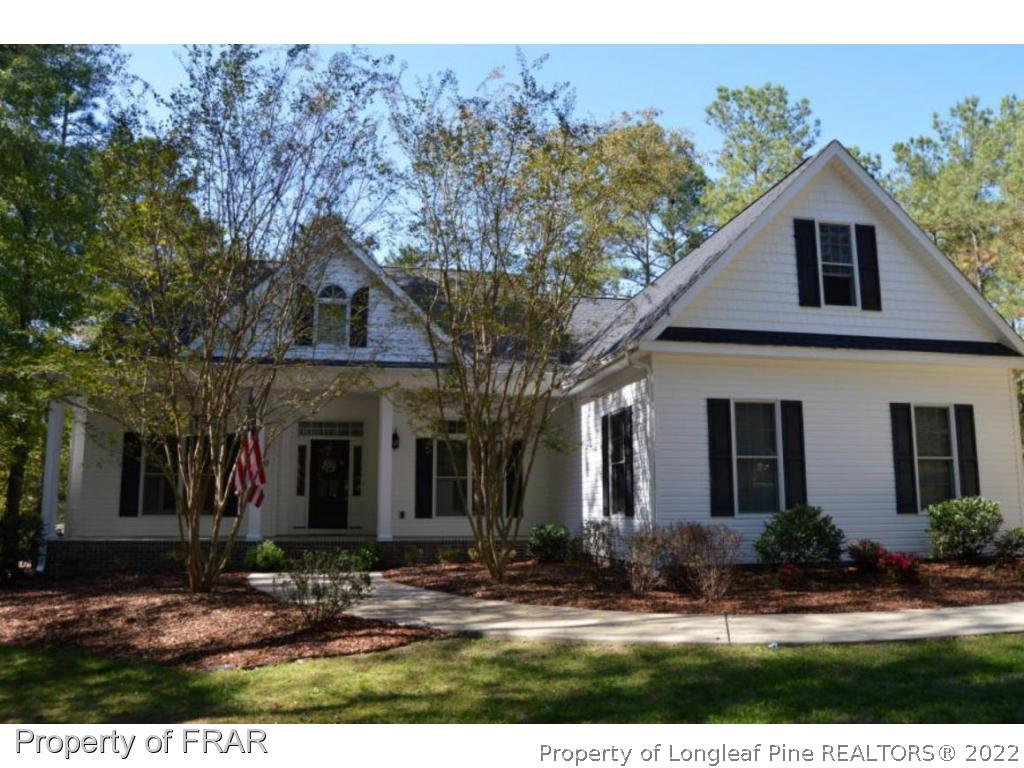 3940 Niagara Carthage Road Whispering Pines, NC 28327 - Photo 1 of 26 a view of a yard in front of a house