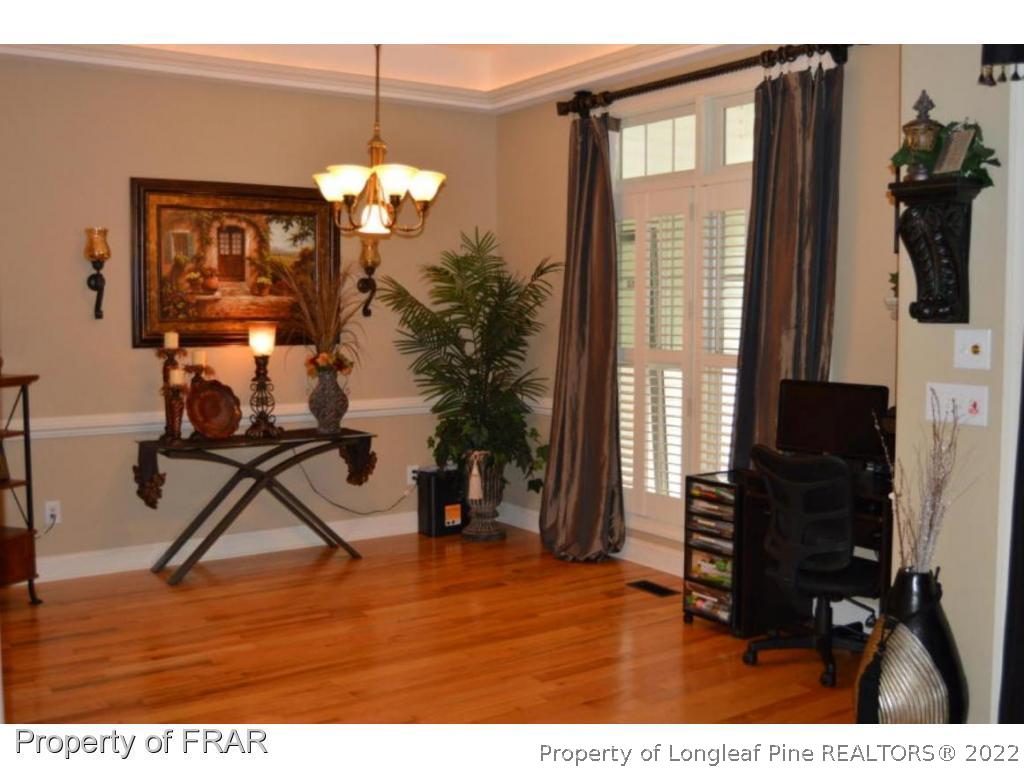 3940 Niagara Carthage Road Whispering Pines, NC 28327 - Photo 23 of 26 a view of a livingroom with furniture and a window