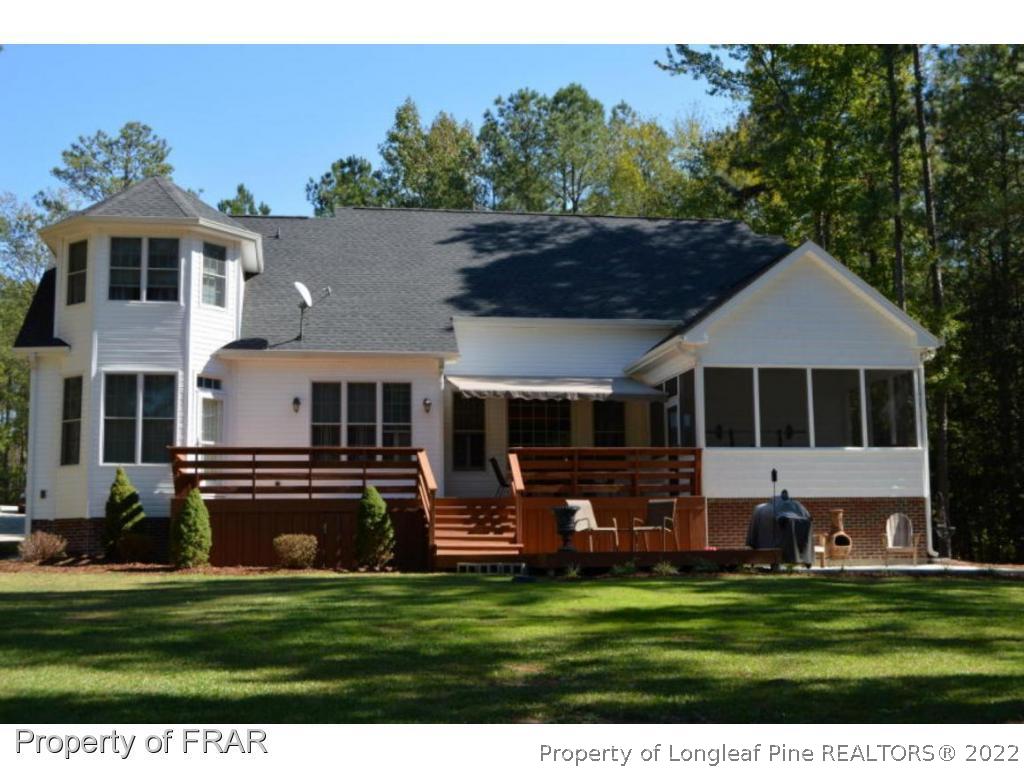 3940 Niagara Carthage Road Whispering Pines, NC 28327 - Photo 25 of 26 a front view of a house with a garden
