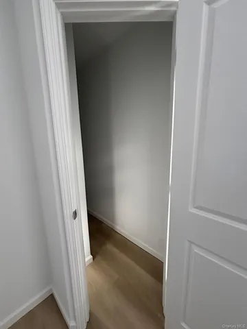 a room with a refrigerator and a stove top oven