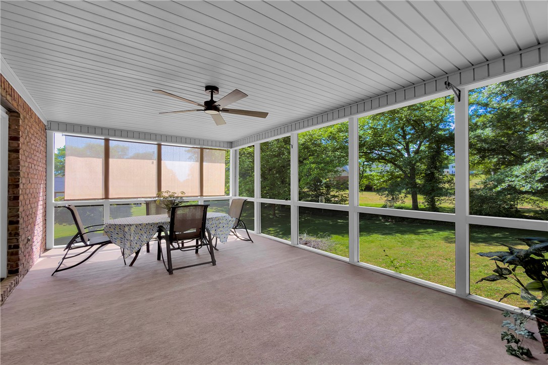 406 Hopewell Ridge Anderson, SC 29621 - Photo 37 of 46 This outdoor space features a screened porch, perfect for enjoying the surrounding green landscape.