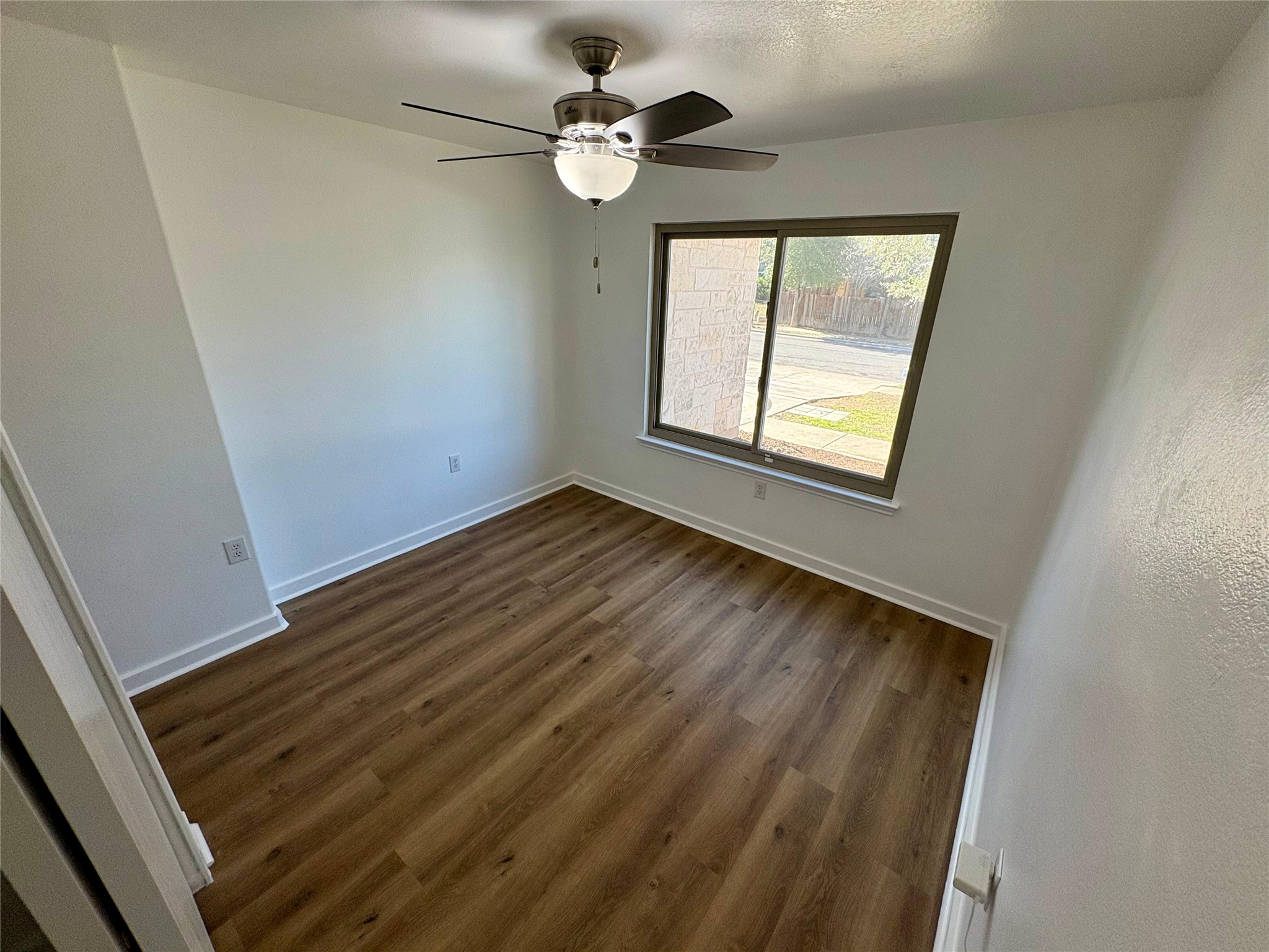 8003 Bannock Lane Austin, TX 78747 - Photo 31 of 40 Bedroom #4 with dark wood-style floors and a ceiling fan