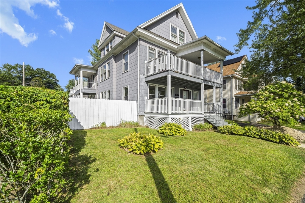 57 Narragansett Street Springfield, MA 01107 - Photo 2 of 41 a front view of a house with a yard