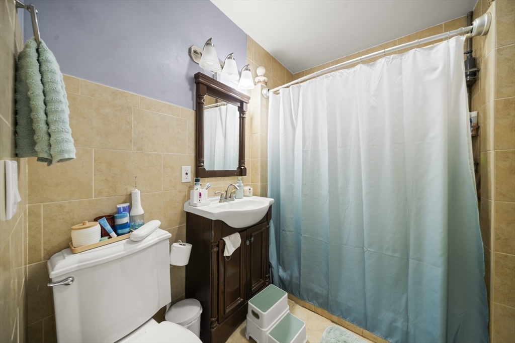 57 Narragansett Street Springfield, MA 01107 - Photo 23 of 41 a bathroom with a sink toilet and shower