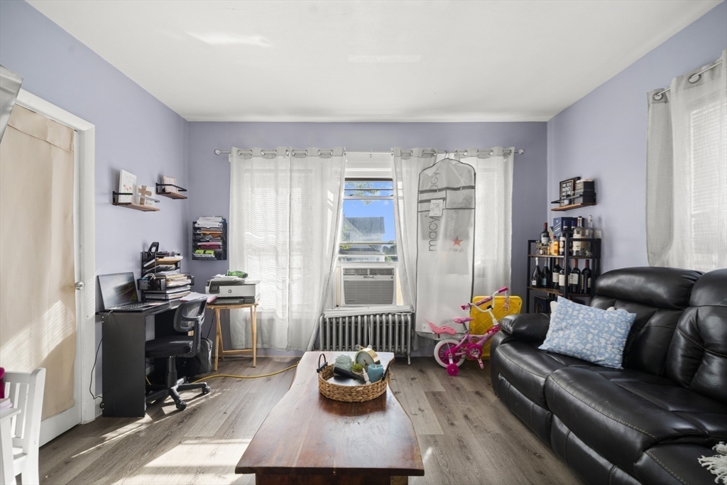 57 Narragansett Street Springfield, MA 01107 - Photo 30 of 41 a living room with furniture toys and a window