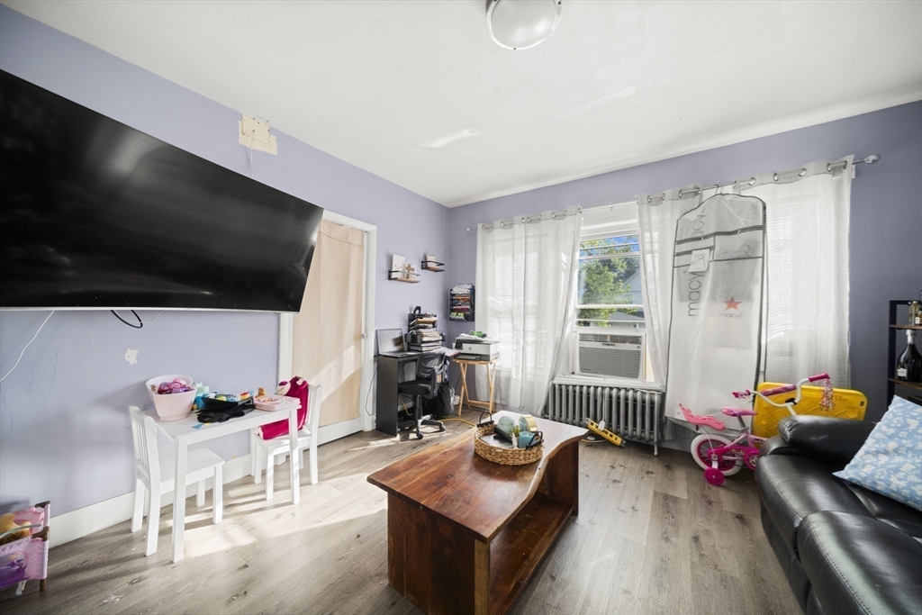57 Narragansett Street Springfield, MA 01107 - Photo 31 of 41 a living room with furniture and a flat screen tv