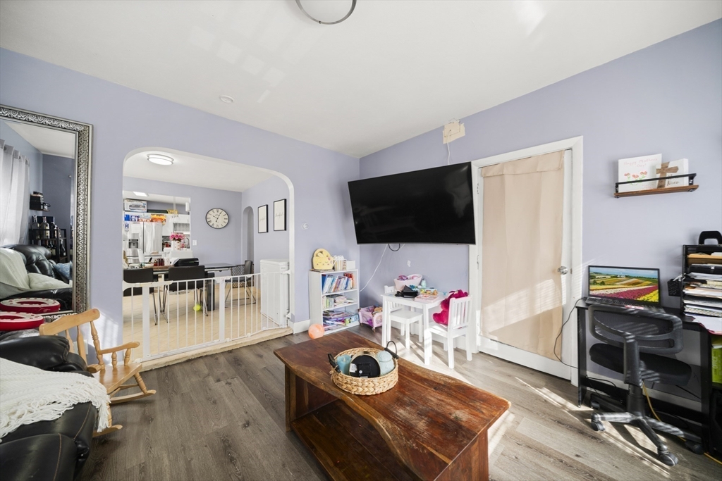 57 Narragansett Street Springfield, MA 01107 - Photo 32 of 41 a living room with furniture and a flat screen tv