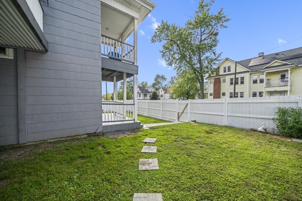 57 Narragansett Street Springfield, MA 01107 - Photo 36 of 41 a front view of a house with a garden