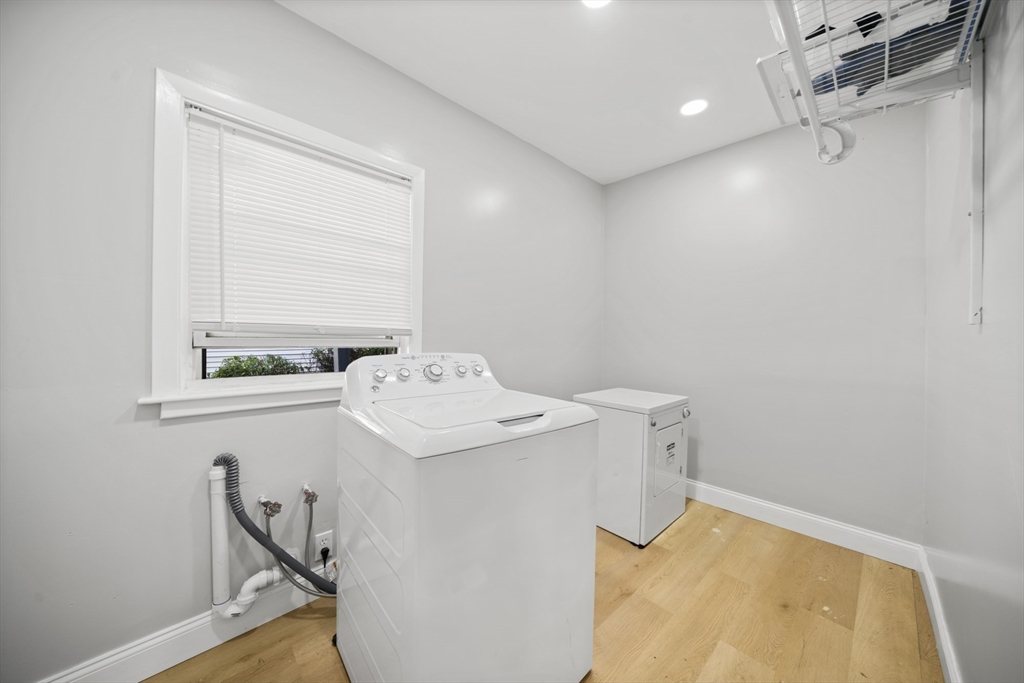 57 Narragansett Street Springfield, MA 01107 - Photo 7 of 41 a utility room with dryer and washer