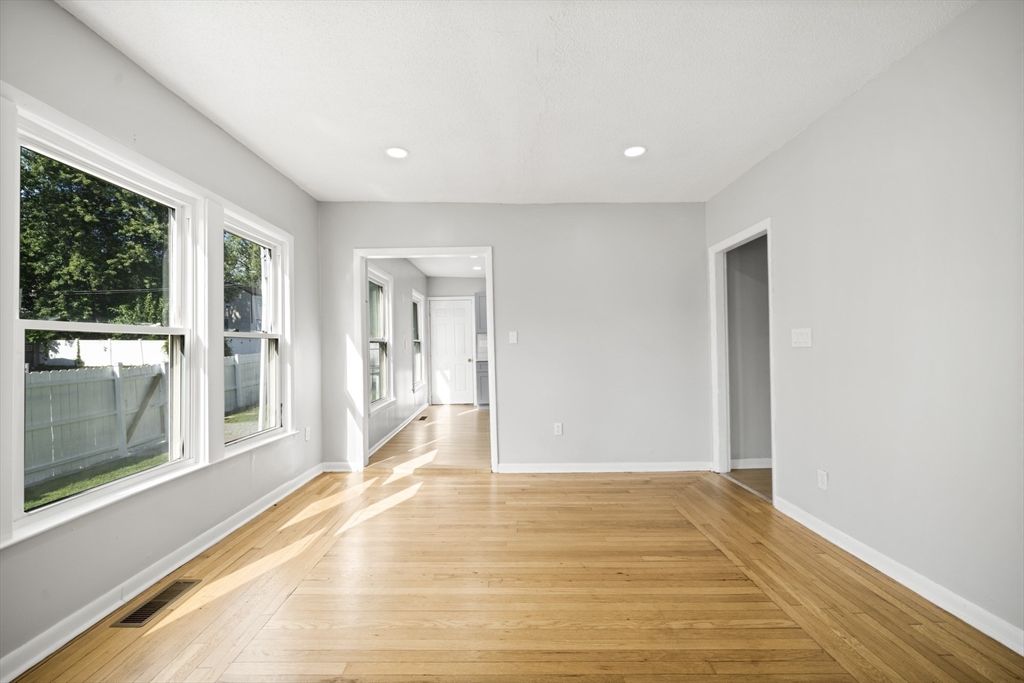 57 Narragansett Street Springfield, MA 01107 - Photo 10 of 41 a view of a big room with wooden floor and windows