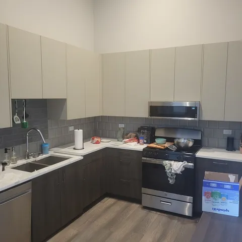 a kitchen with a sink and cabinets