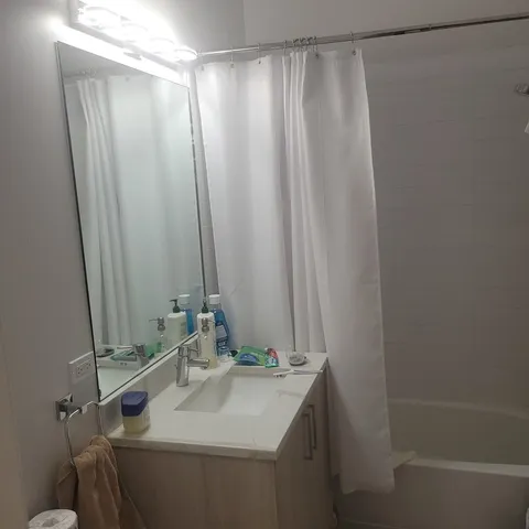 a bathroom with a sink and a mirror