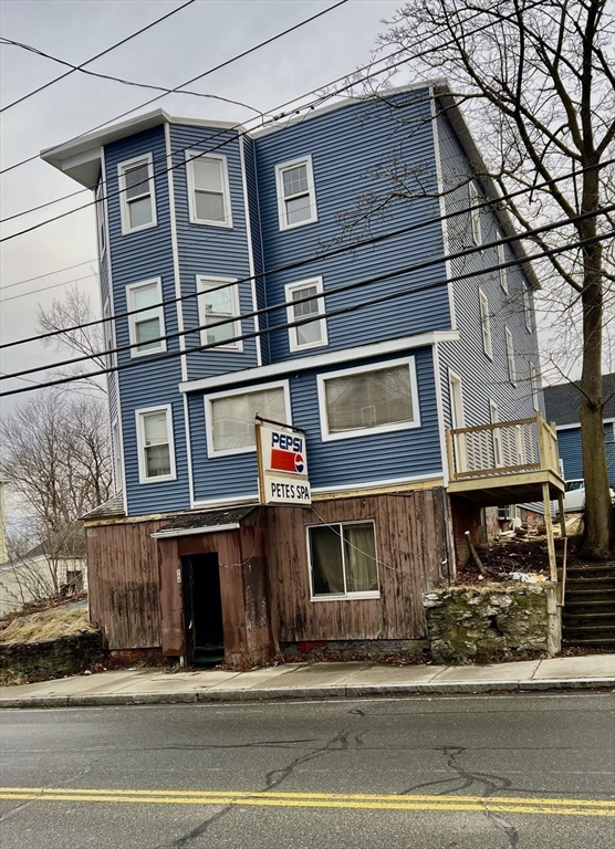 564 Main Street Southbridge, MA 01550 - Photo 13 of 18 a view of a building with a street