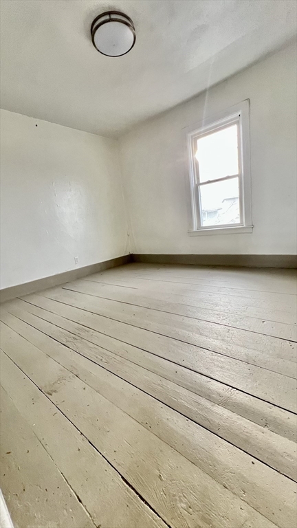 564 Main Street Southbridge, MA 01550 - Photo 8 of 18 a view of a hardwood floor and a window