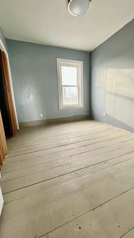 564 Main Street Southbridge, MA 01550 - Photo 9 of 18 a view of an empty room with a window
