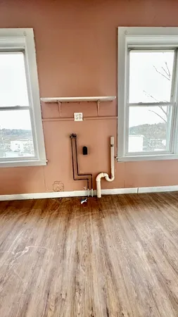 a bed room with a bed and a window