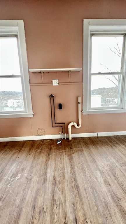 564 Main Street Southbridge, MA 01550 - Photo 10 of 18 a view of a room with wooden floor and a window