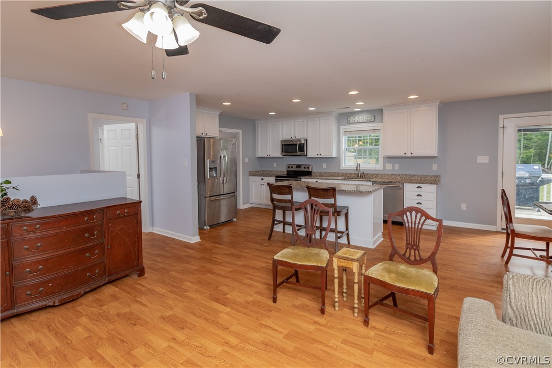 1394 Falls Road Victoria, VA 23974 - Photo 12 of 45 a view of kitchen with cabinets stainless steel appliances dining table and chairs