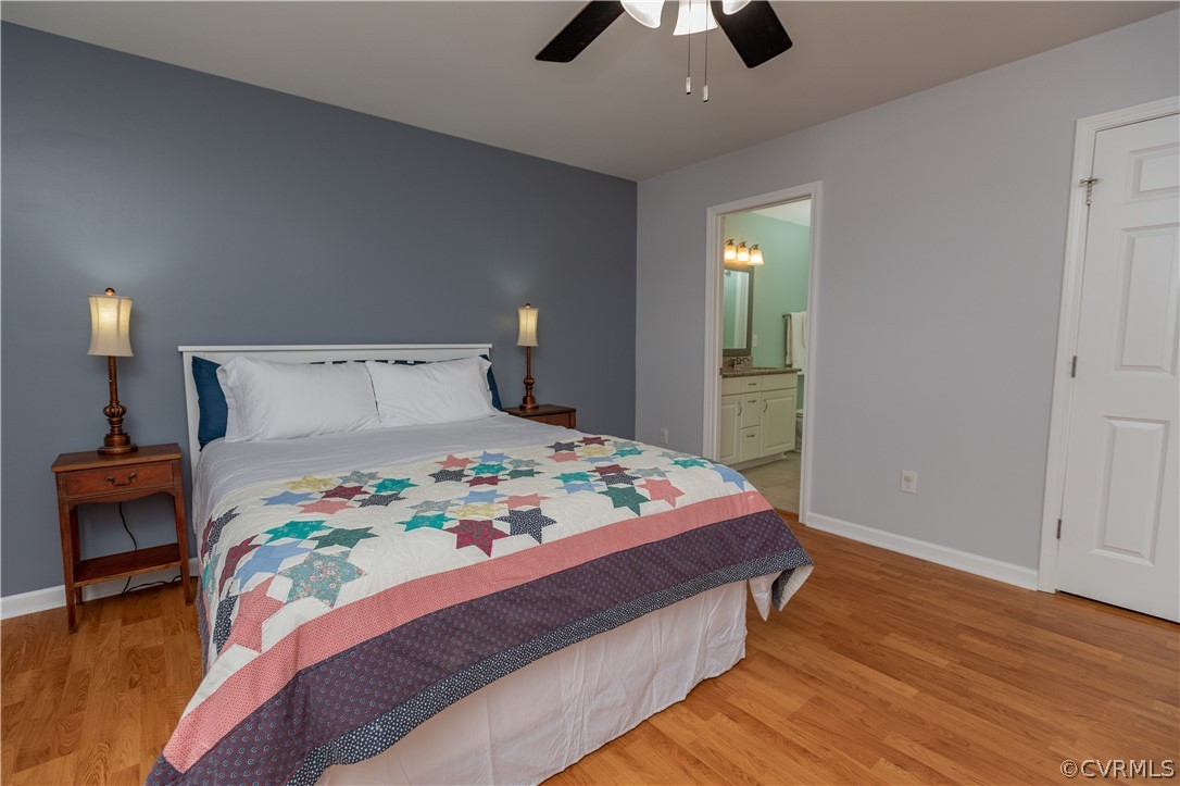 1394 Falls Road Victoria, VA 23974 - Photo 14 of 45 a bedroom with a bed and wooden floor