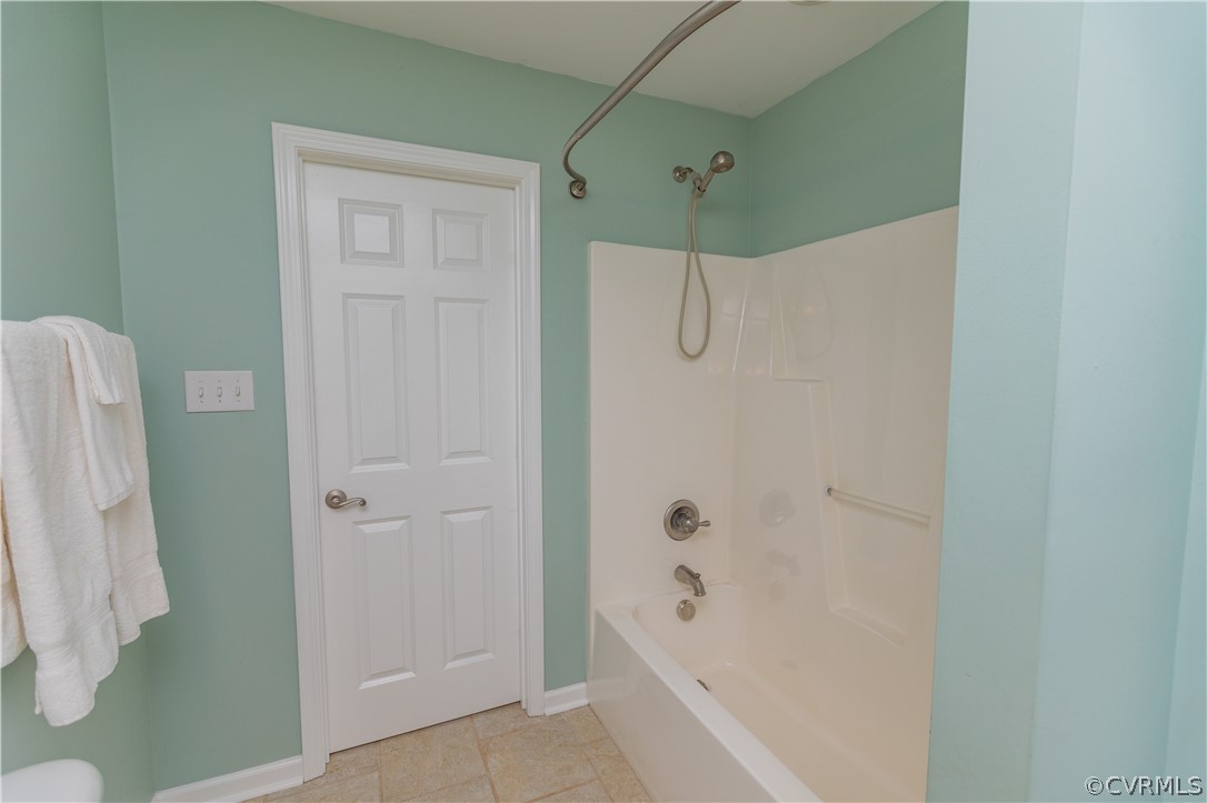 1394 Falls Road Victoria, VA 23974 - Photo 16 of 45 a bathroom with a bathtub and shower