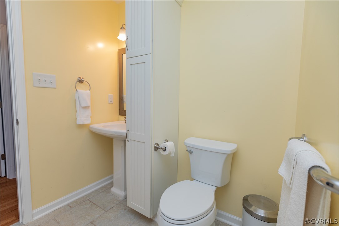 1394 Falls Road Victoria, VA 23974 - Photo 23 of 45 a white toilet sitting next to a bathroom sink