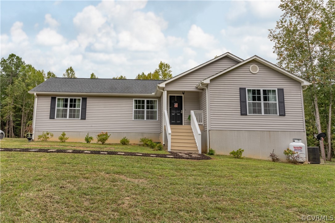 1394 Falls Road Victoria, VA 23974 - Photo 31 of 45 a front view of a house with a garden