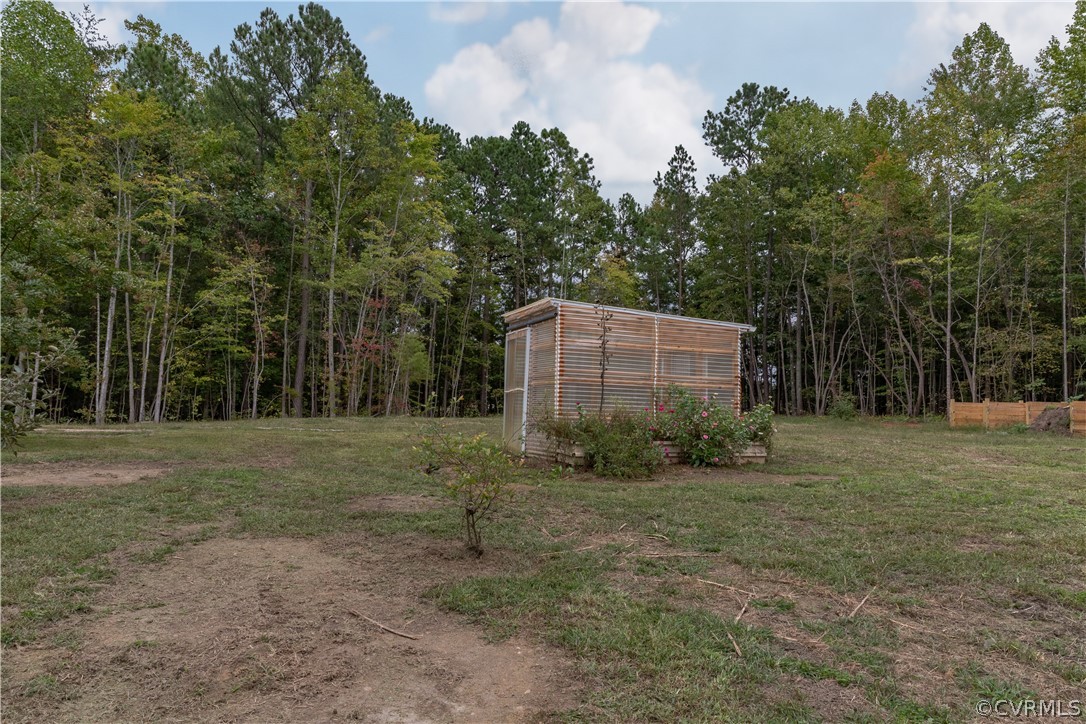 1394 Falls Road Victoria, VA 23974 - Photo 37 of 45 a backyard of a house with lots of trees
