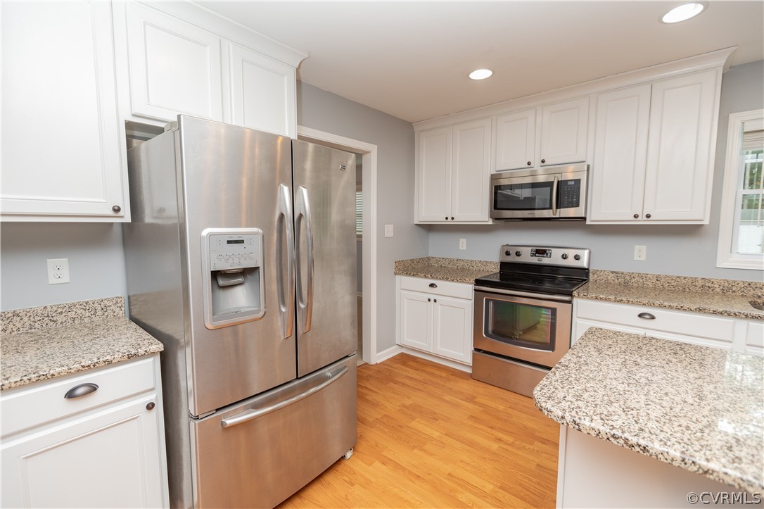 1394 Falls Road Victoria, VA 23974 - Photo 6 of 45 a kitchen with stainless steel appliances granite countertop a refrigerator stove and microwave