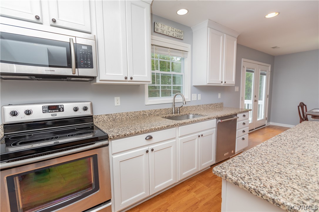 1394 Falls Road Victoria, VA 23974 - Photo 7 of 45 a kitchen with stainless steel appliances granite countertop a sink and cabinets