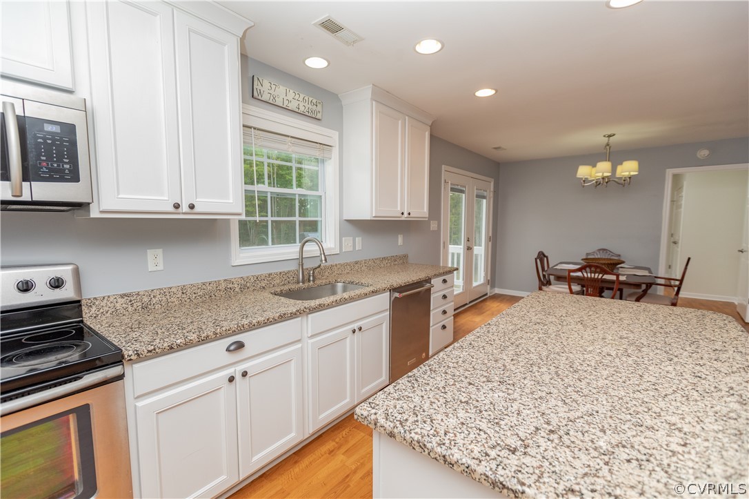 1394 Falls Road Victoria, VA 23974 - Photo 8 of 45 a kitchen with sink cabinets and window