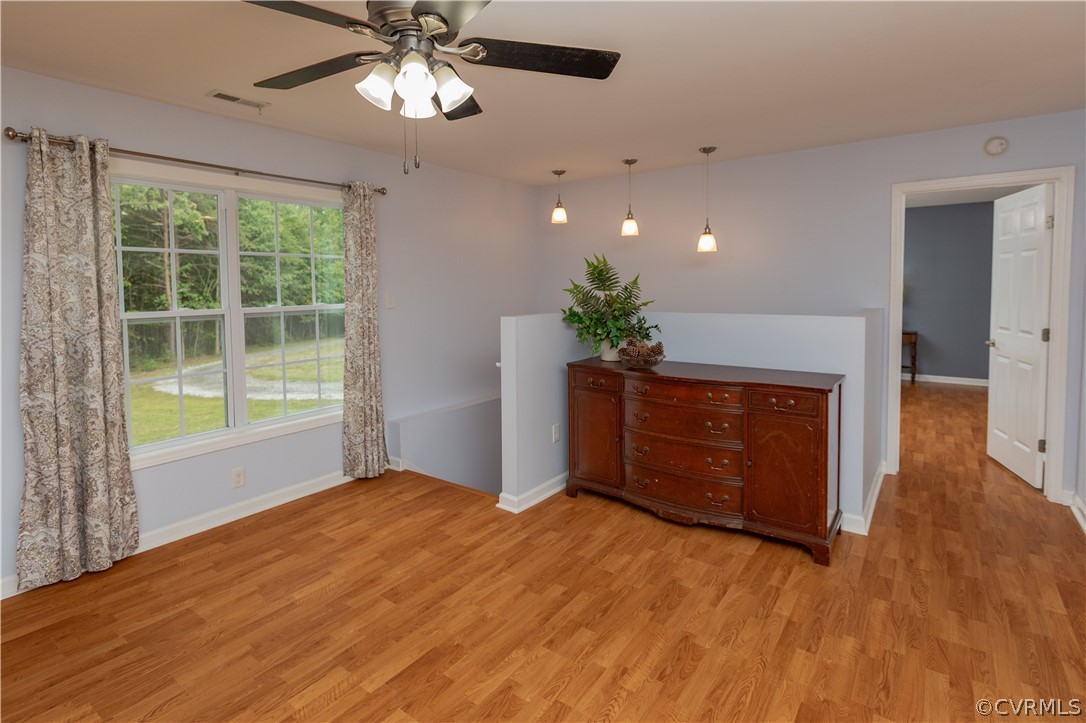 1394 Falls Road Victoria, VA 23974 - Photo 10 of 45 a view of an empty room with a window and wooden floor