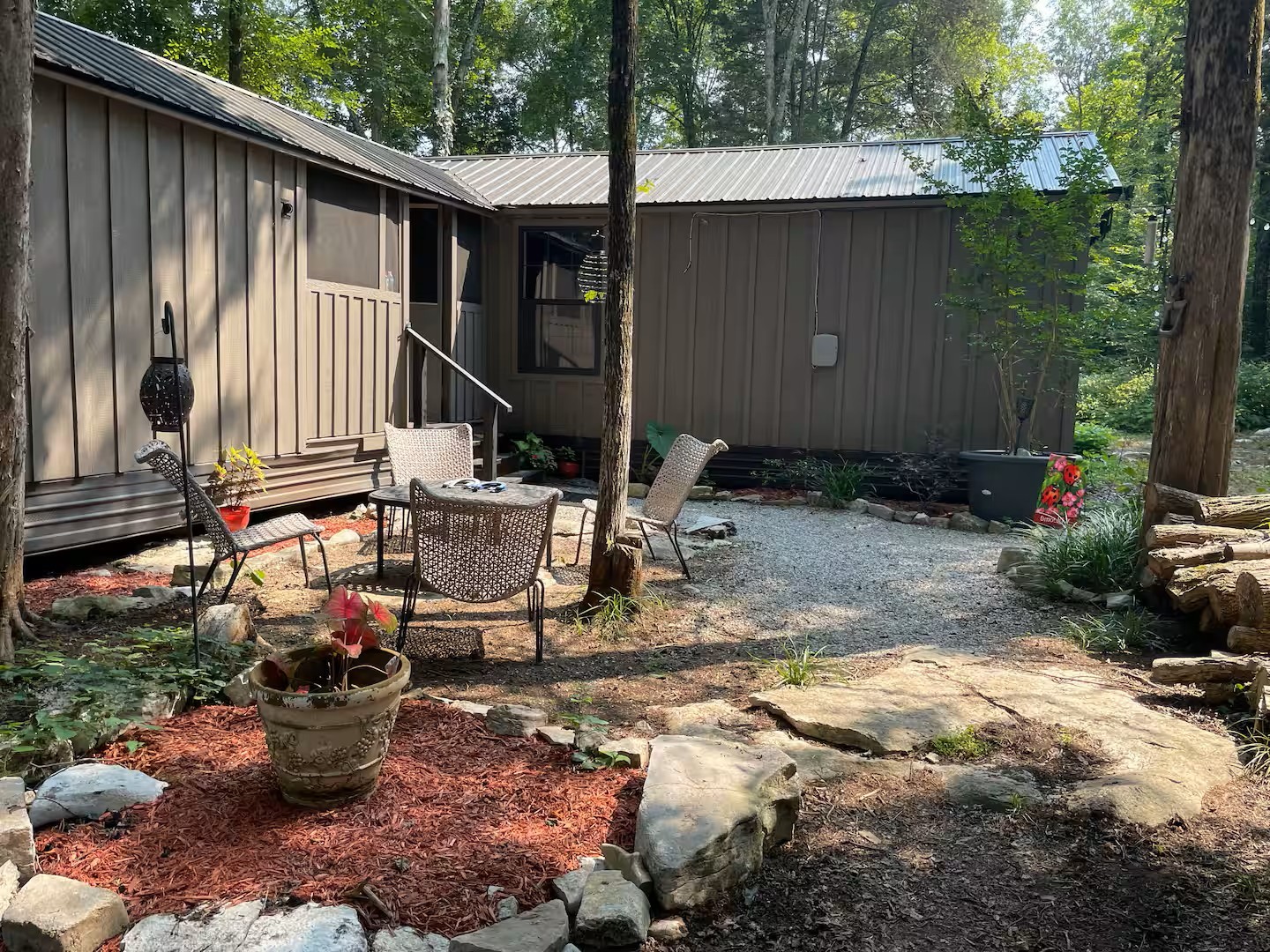 233 Porterfield Road Readyville, TN 37149 - Photo 14 of 32 a view of a house with backyard sitting area and garden