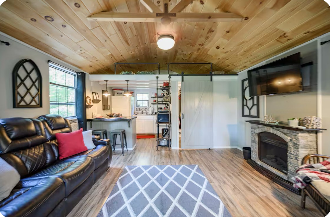 233 Porterfield Road Readyville, TN 37149 - Photo 21 of 32 a living room with furniture and a fireplace