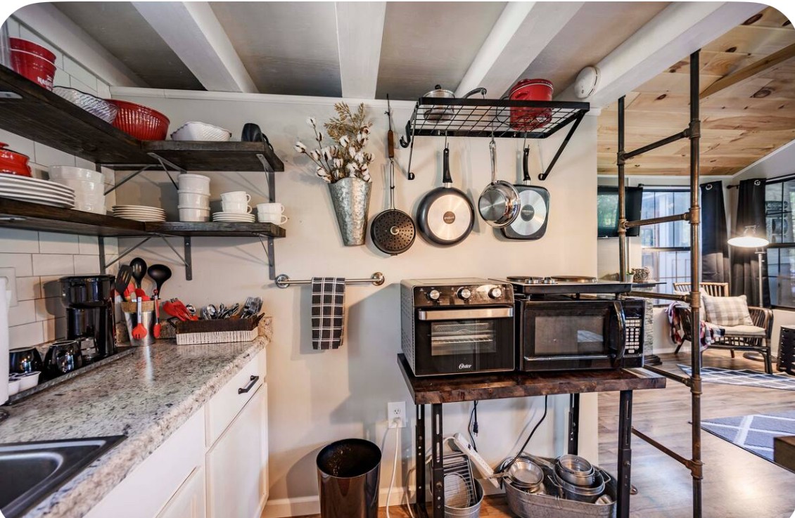 233 Porterfield Road Readyville, TN 37149 - Photo 22 of 32 a kitchen with a refrigerator and a stove