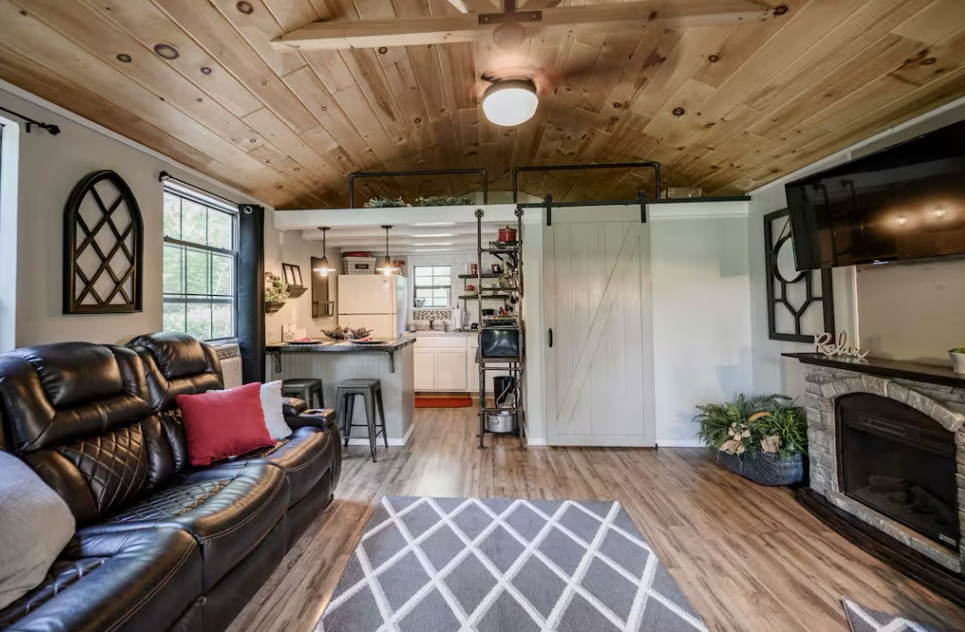 233 Porterfield Road Readyville, TN 37149 - Photo 24 of 32 a living room with furniture and a fireplace