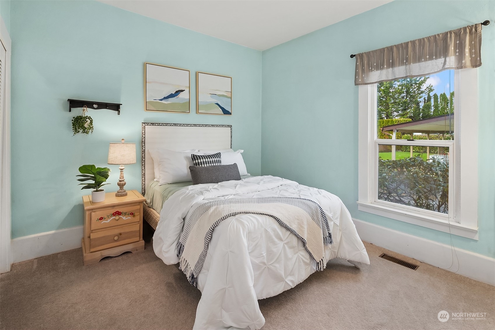 705 3rd Street Sultan, WA 98294 - Photo 14 of 26 a bed sitting in a bedroom next to a window